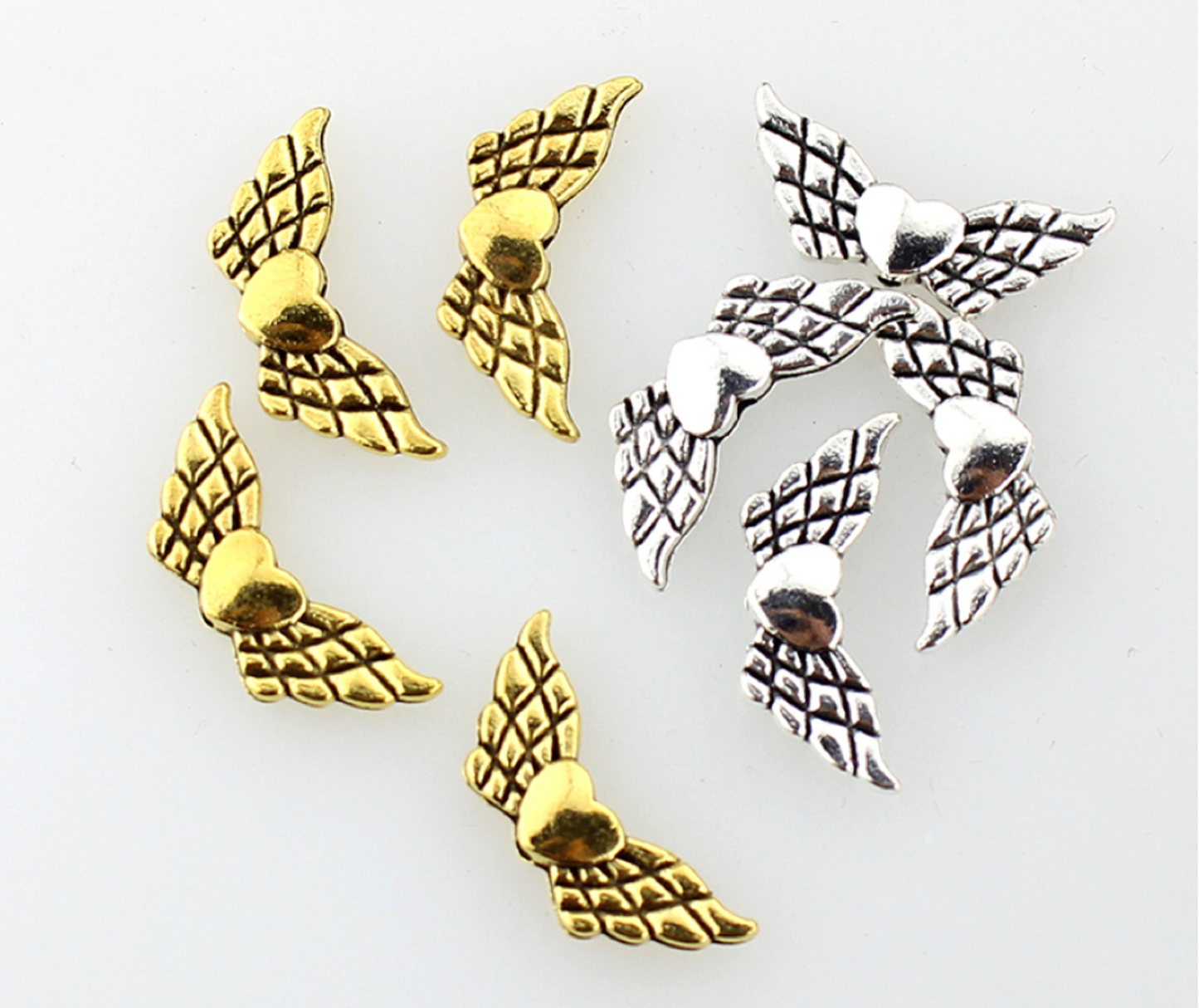 100 Pcs / Tibetan Angel Wing Spacer F009